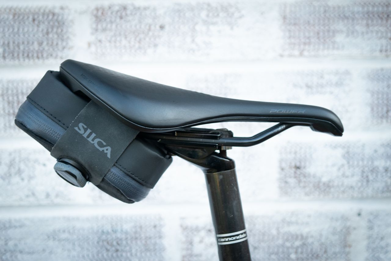 Silca Mattone seat pack in black attached to saddle rails using Boa closure system