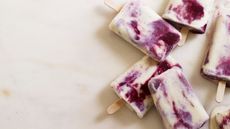 White chocolate ice lollies with plum and star anise
