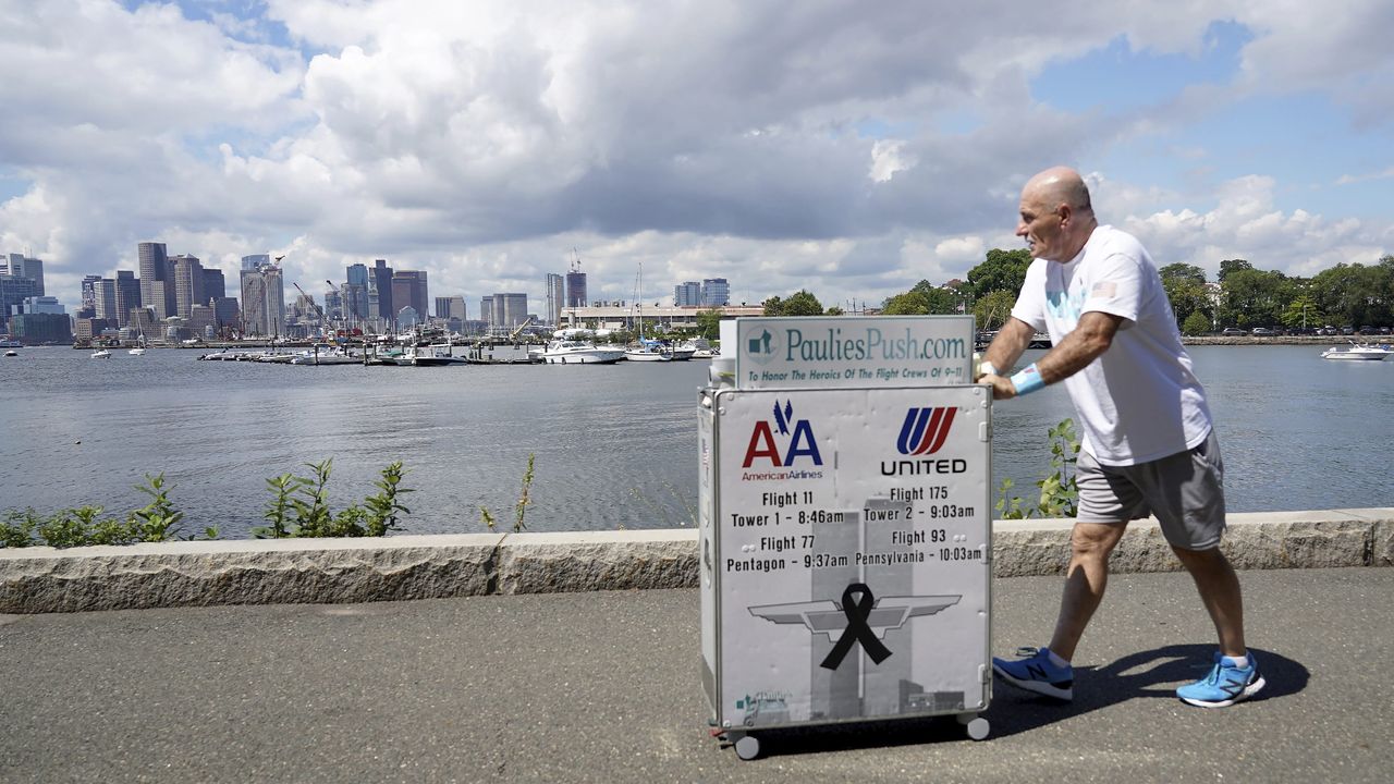 Paul Veneto pushes his beverage cart.