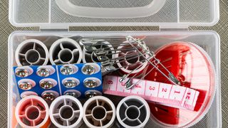 Sewing kit in plastic container