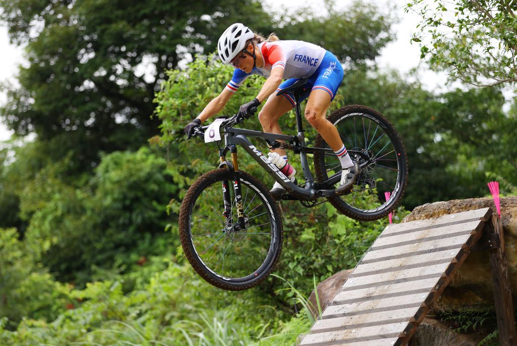 IZU JAPAN JULY 27 Loana Lecomte of Team France jumps during the Womens Crosscountry race on day four of the Tokyo 2020 Olympic Games at Izu Mountain Bike Course on July 27 2021 in Izu Shizuoka Japan Photo by Tim de WaeleGetty Images