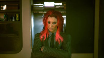 V with pink hair wearing a suit standing in front of the wardrobe in Cyberpunk 2077.