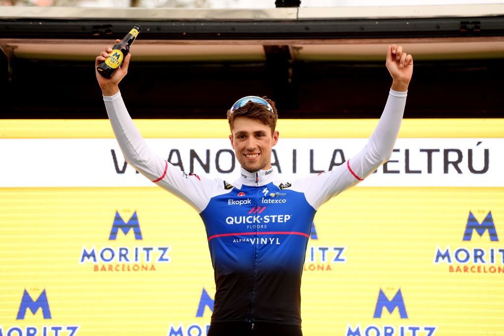 VILANOVA I LA GELTRU SPAIN MARCH 25 Ethan Vernon of United Kingdom and Team QuickStep Alpha Vinyl celebrates winning the stage on the podium ceremony after the 101st Volta Ciclista a Catalunya 2022 Stage 5 a 2063km stage from La Pobla de Segur to Vilanova i la Geltr VoltaCatalunya101 WorldTour on March 25 2022 in Vilanova i la Geltru Spain Photo by David RamosGetty Images