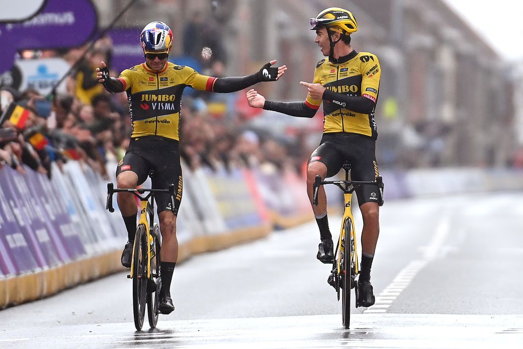 WEVELGEM BELGIUM MARCH 26 Christophe Laporte of France and Team JumboVisma R celebrates at finish line as race winner dedicating the victory to his teammate Wout Van Aert of Belgium and Team JumboVisma L who crosses in second place during the 85th GentWevelgem in Flanders Fields 2023 Mens Elite a 2609km one day race from Ypres to Wevelgem UCIWT on March 26 2023 in Wevelgem Belgium Photo by Tim de WaeleGetty Images