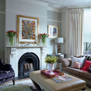 living area with fireplace and sofa with cushions and armchair