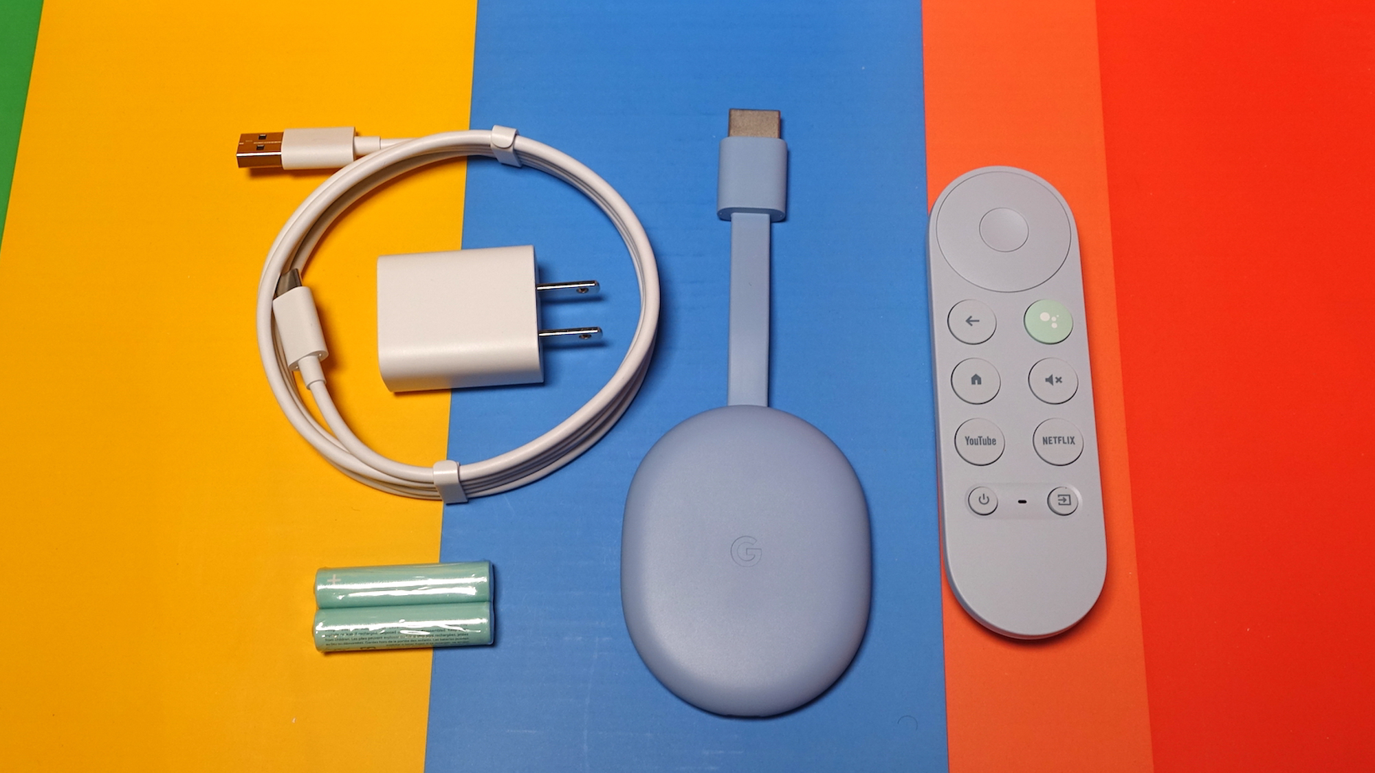 (L to R): Power adapter, cable, batteries, Chromecast with Google TV 4K and remote