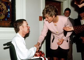 Princess Diana shaking the hand of a patient with AIDS