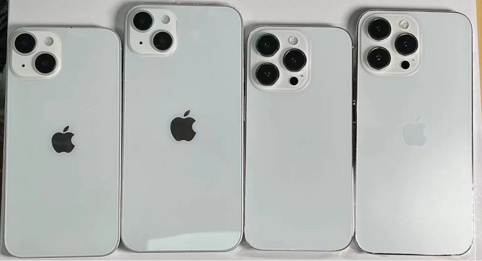 Four iPhone 14 dummy models on white background