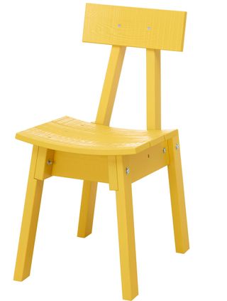 yellow industriell chair with white backgrouns