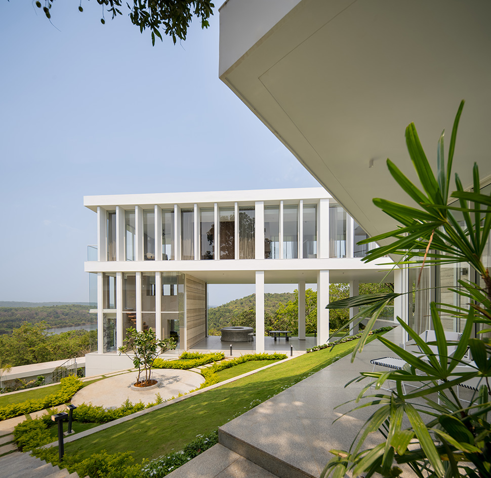 a white Goa villa in the leafy indian forest