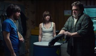 10 Cloverfield Lane the bunker survivors circle around a container