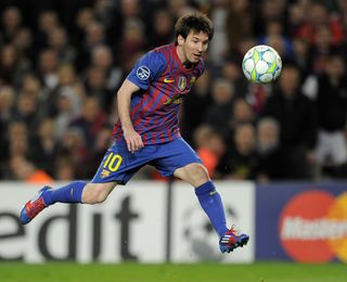 Lionel Messi scores one of his five goals for Barcelona against Bayer Leverkusen in the Champions League at Camp Nou in March 2012.