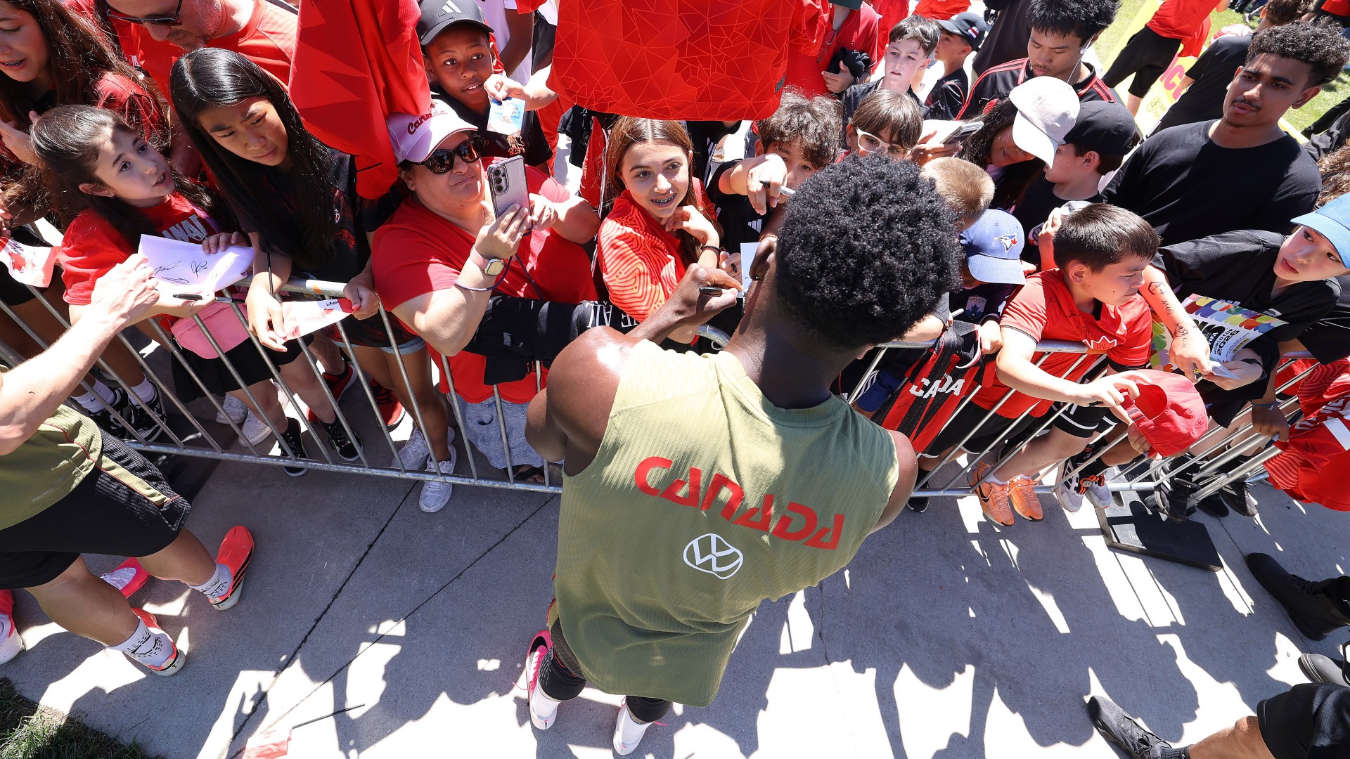 Alphonso Davies #19 of Canada signs autographs afterward as Canada's FIFA 2026 World Cup team trains