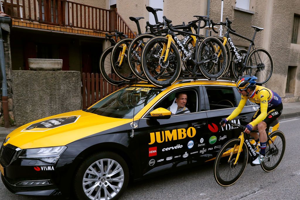 BOLLNE FRANCE MARCH 11 Primoz Roglic of Slovenia and Team Jumbo Visma Yellow Leader Jersey Grischa Niermann of Germany Sports director Team Jumbo Visma during the 79th Paris Nice 2021 Stage 5 a 200km stage from Vienne to Bollne Refreshment Tacx bottle Feed Zone Feeding ParisNice on March 11 2021 in Bollne France Photo by Bas CzerwinskiGetty Images