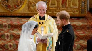 Prince Harry and Meghan Markle stand at the altar at St George's Chapel