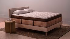 The Helix Plus Elite mattress in a warm bedroom