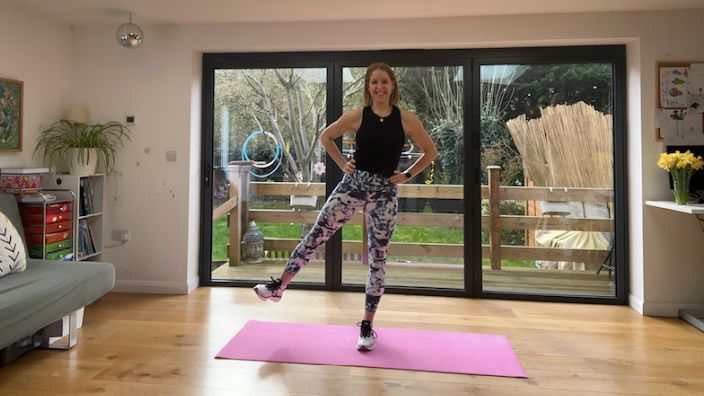 Woman performing a side leg raise