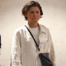 Zendaya was spotted in Beverly Hills wearing a minimalist outfit: white jacket, a matching T-shirt, black trousers, and The Row loafers