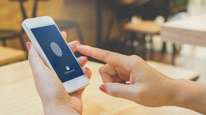 Hand holding smartphone and scan fingerprint biometric identity for unlock her mobile phone