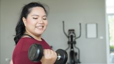 Woman doing dumbbell workout at home