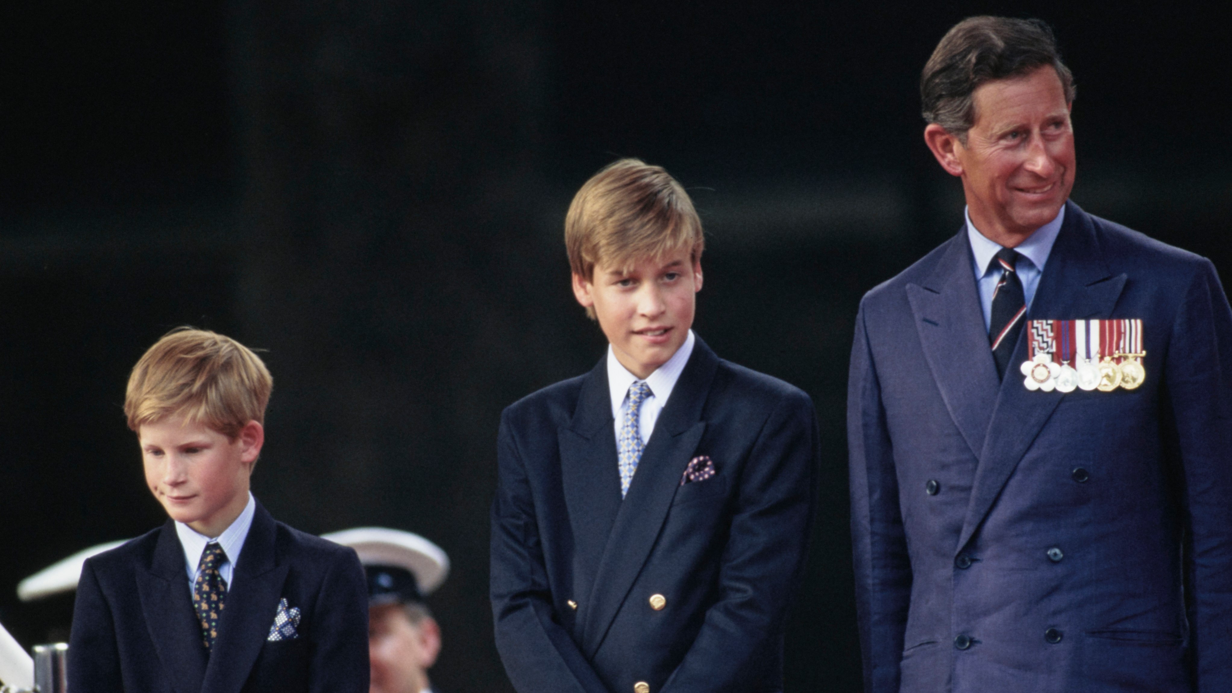 Prince Harry, Prince William, and King Charles attend the parade commemorating VJ Day, outside Buckingham Palace in London, England, 19th August 1994