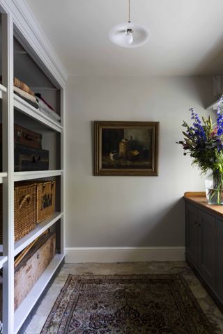 Grey walls and built in shelving cabinet