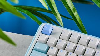 A white and blue Epomaker TH99 96% mechanical keyboard