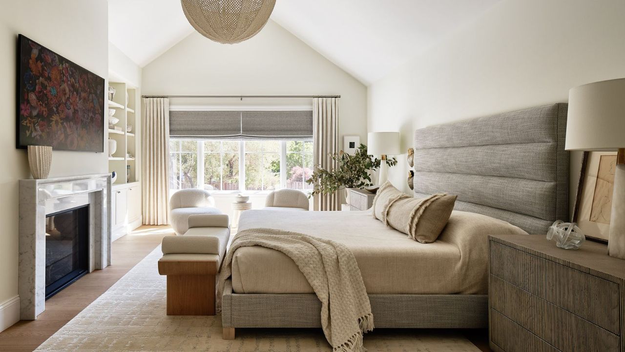 neutral coastal style bedroom with gray tones and a woven pendant light