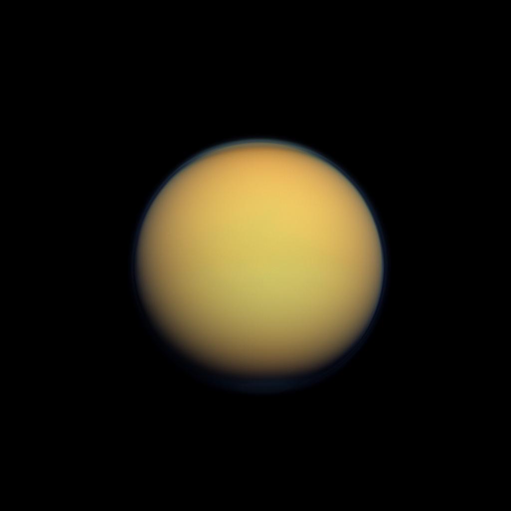 Saturn&#039;s moon Titan appears as a hazy ball from a distance in this photo taken by NASA&#039;s Cassini spacecraft.