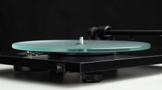 Pro-Ject T1 EVO from an angle, showing a focus on the glass platter