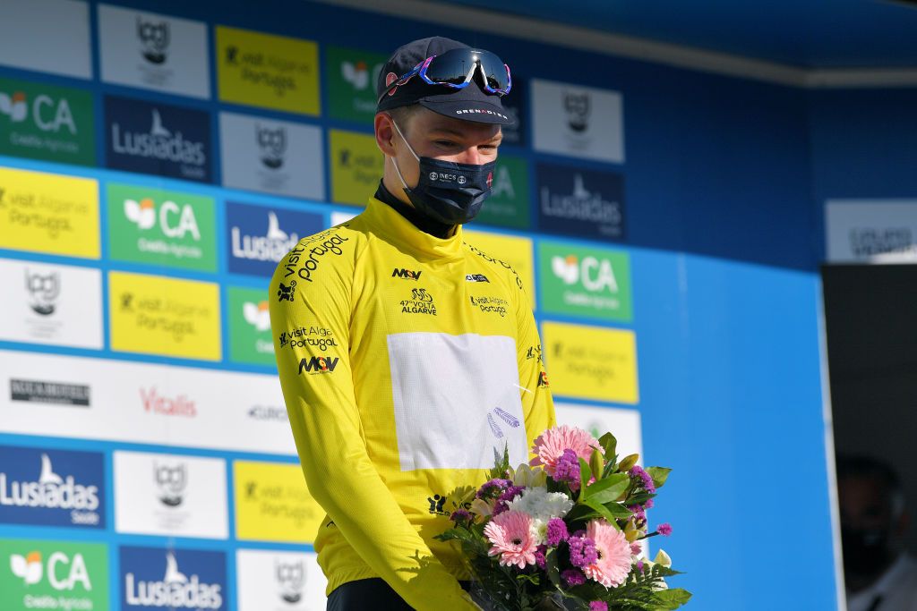 FOIA PORTUGAL MAY 06 Ethan Hayter of United Kingdom and Team INEOS Grenadiers yellow leader jersey celebrates at podium during the 47th Volta Ao Algarve 2021 Stage 2 a 1828km stage from Sagres to Fia 890m Mask Covid safety measures VoltAlgarve VAlgarve2021 on May 06 2021 in Fia Portugal Photo by Luc ClaessenGetty Images