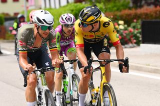 TREVISO ITALY MAY 26 LR Dries De Bondt of Belgium and Team Alpecin Fenix and Edoardo Affini of Italy and Team Jumbo Visma discuss taking relays by competing in the breakaway during the 105th Giro dItalia 2022 Stage 18 a 156km stage from Borgo Valsugana to Treviso Giro WorldTour on May 26 2022 in Treviso Italy Photo by Tim de WaeleGetty Images