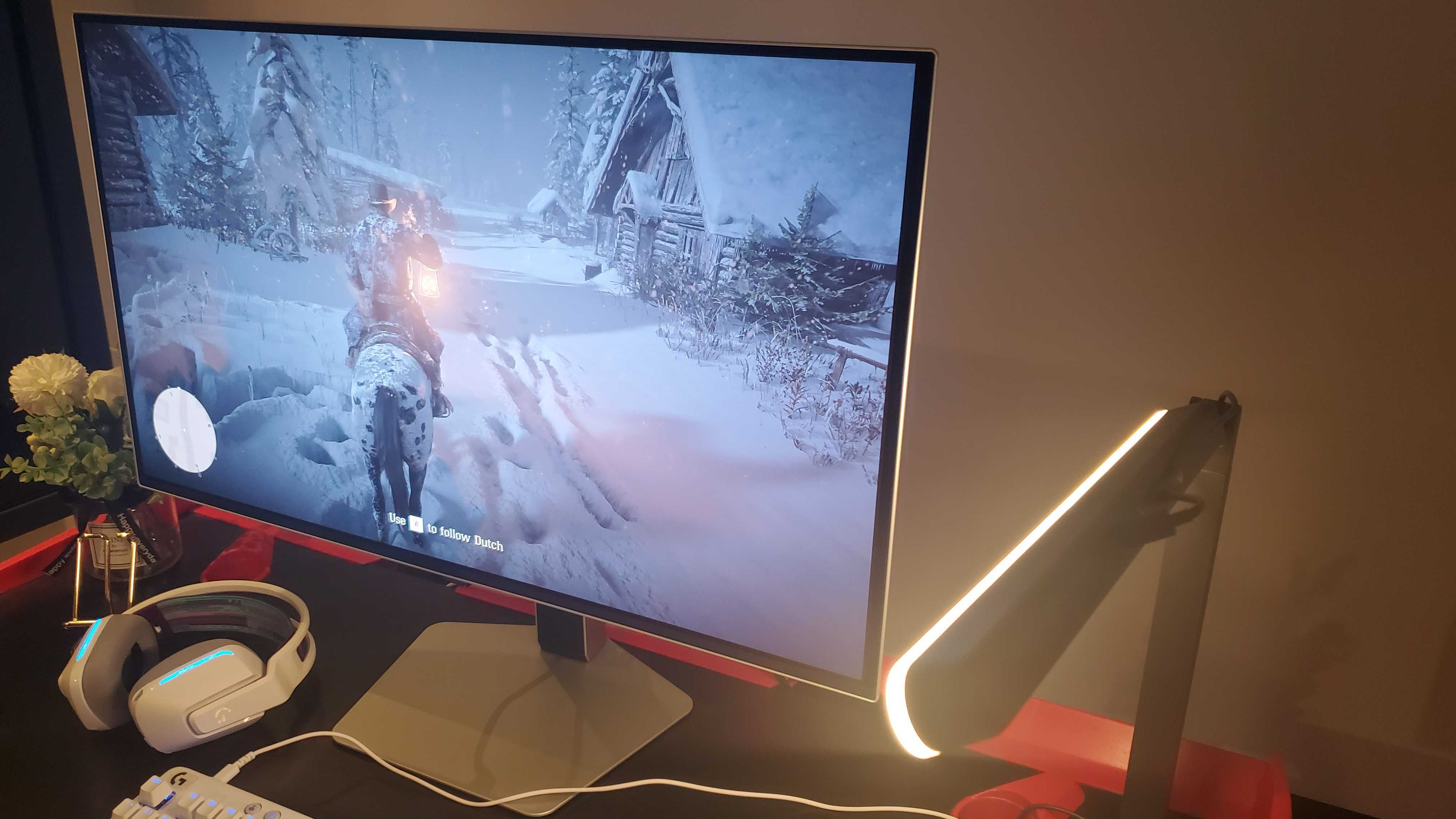 gaming monitor near white keyboard