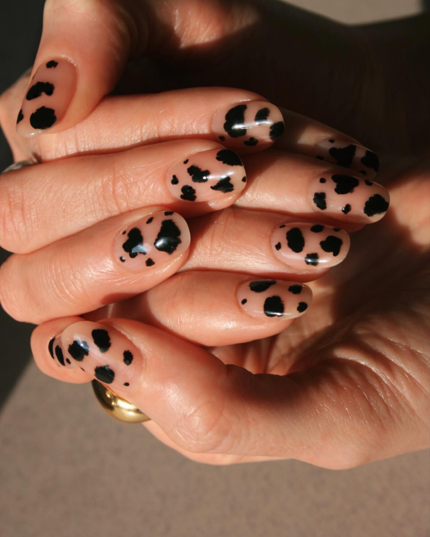 Imarni nails black cow print nail art design