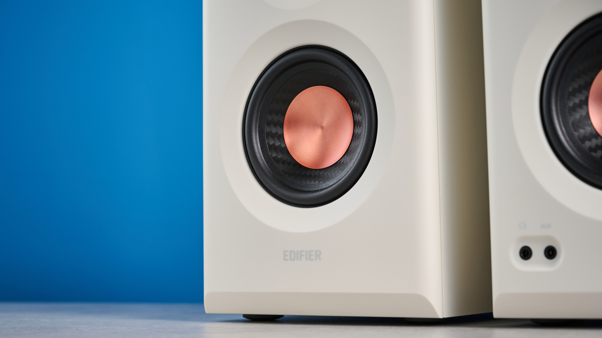 the Edifier MR5 studio monitors bookshelf speakers photographed with the blue tom's guide background