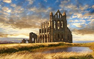 Gothic Whitby Abbey at sunset, Whitby, North Yorkshire, England, United Kingdom, Europe