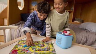 Toniebox 2 playing Game of Life lifestyle photo with two kids