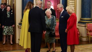 LONDON, ENGLAND - DECEMBER 03: Princess Anne, Princess Royal (L) watches as Queen Elizabeth II talks to US President Donald Trump and wife Melania as she hosts a reception for NATO leaders at Buckingham Palace on December 3, 2019 in London, England. Her Majesty Queen Elizabeth II hosted the reception at Buckingham Palace for NATO Leaders to mark 70 years of the NATO Alliance.