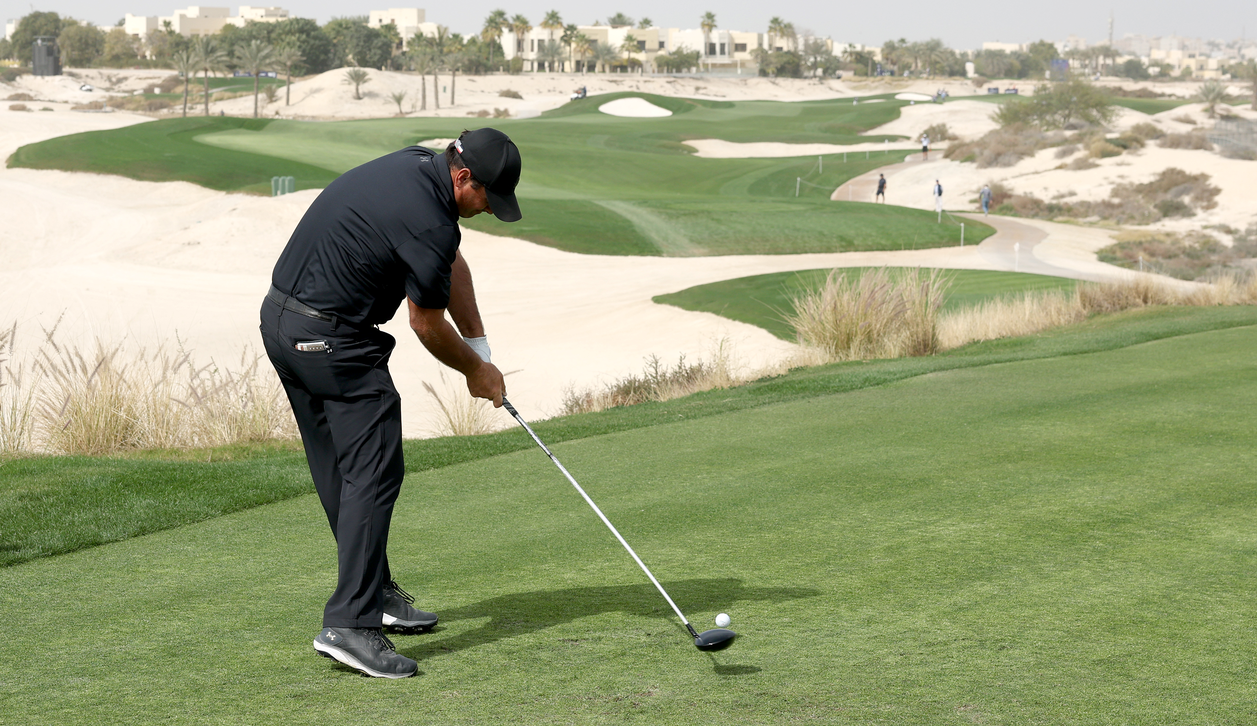 Patrick Reed hits a driver