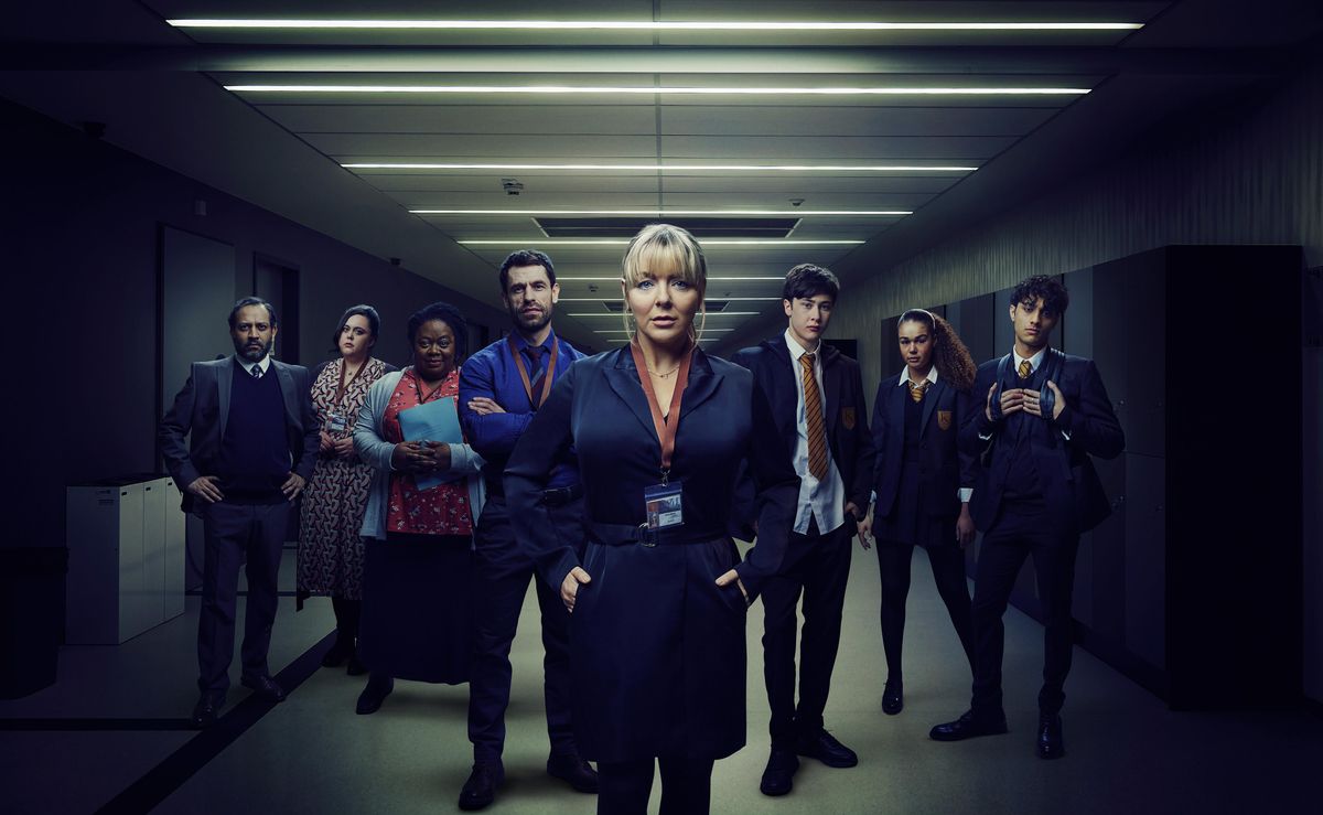 The cast of The Teacher in a posed group shot: (L-R) Anil Desai as Mr Mills, Sharon Rooney as Nina, Cecilia Noble as Pauline, Kelvin Fletcher as Jack, Sheridan Smith as Jenna, Samuel Bottomley as Kyle, Tillie Amartey as Izzy, Aaronveer Dhillon as Adnan