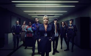 The cast of The Teacher in a posed group shot: (L-R) Anil Desai as Mr Mills, Sharon Rooney as Nina, Cecilia Noble as Pauline, Kelvin Fletcher as Jack, Sheridan Smith as Jenna, Samuel Bottomley as Kyle, Tillie Amartey as Izzy, Aaronveer Dhillon as Adnan