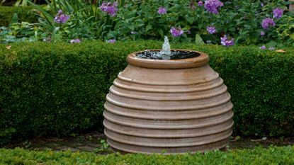 how to keep a water feature clean: terracotta water feature