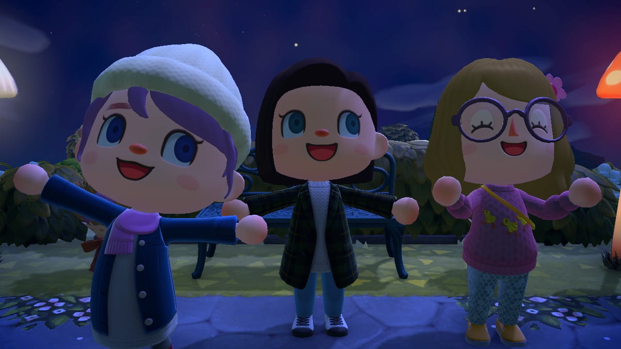 Three girls face the camera with big smiles in Animal Crossing New Horizons