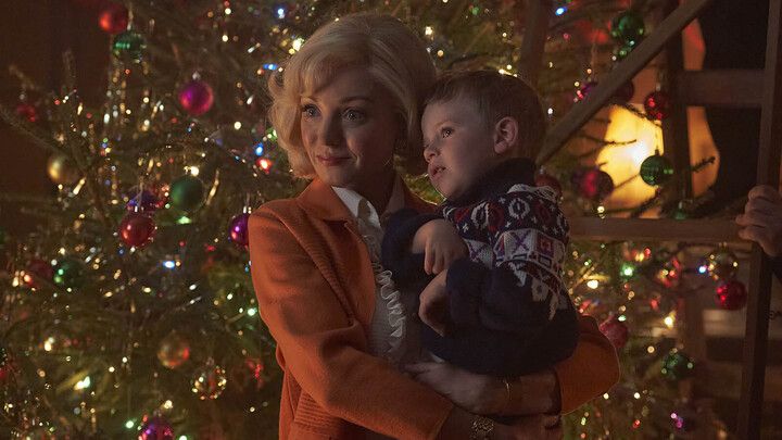 Trixie Franklin (HELEN GEORGE) and Jonty Aylward (ARCHIE O&#039;CALLAGHAN) in Call the Midwife standing in front of a Christmas tree 