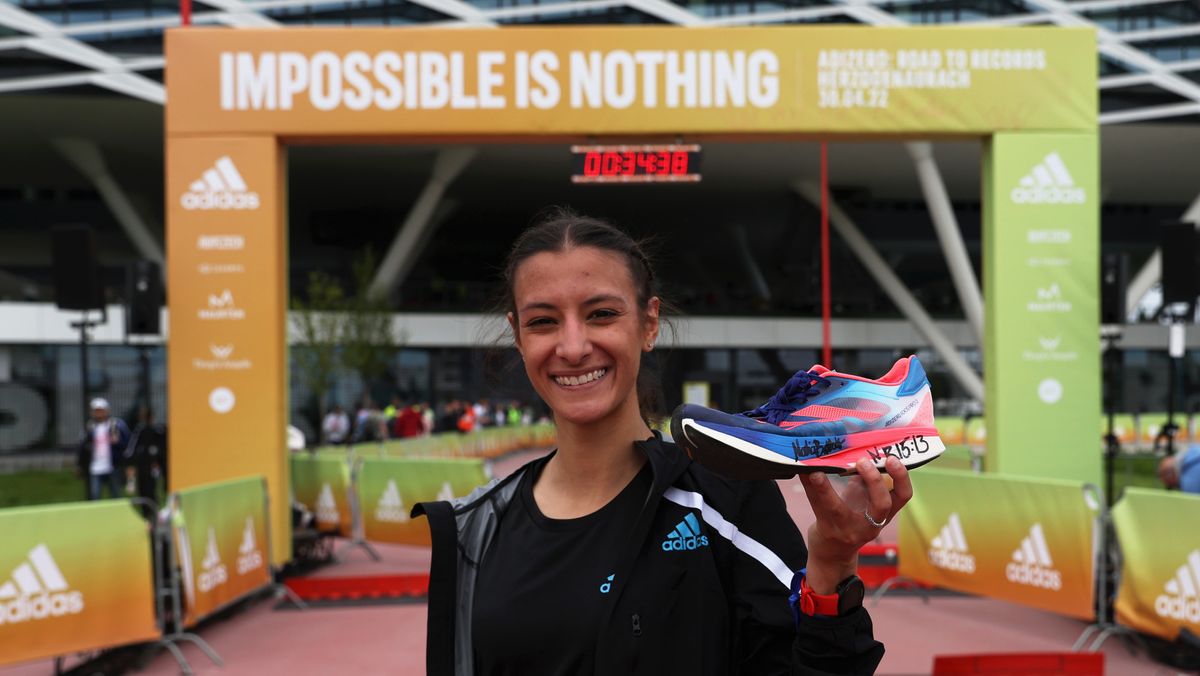 Nadia Battocletti of Italy holding Adidas Adizero Adios Pro 2 shoe she set a National Record after Women&#039;s 5km Race. World class road runners compete at the second annual adidas’ ADIZERO: Road to Records, at the brand’s HQ in Herzogenaurach on April 30, 2022