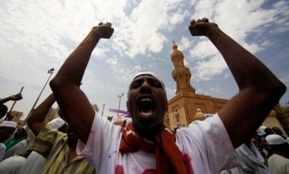 Sudanese demonstrators head toward the German and U.S. embassies in Khartoum on Friday: The U.S. has ordered non-essential embassy staff to leave Sudan in the wake of violent protests.
