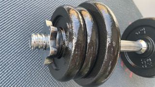 Image of Amazon Basics dumbbell being used at home