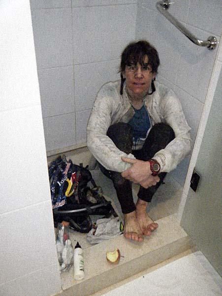 Rebecca Rusch showers after a wet stage.