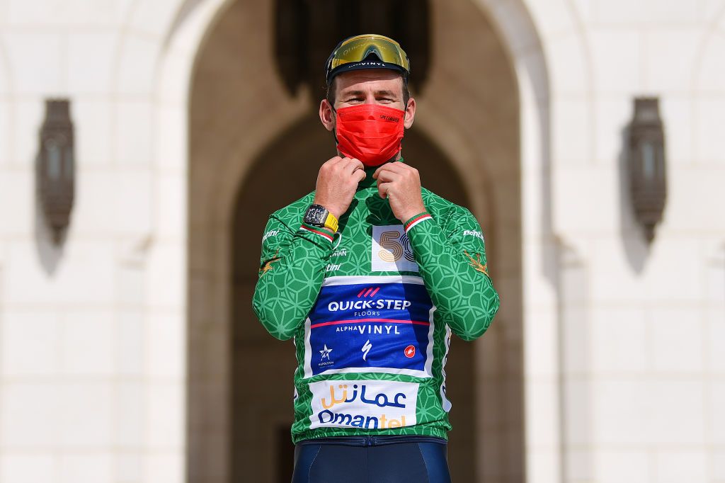 MUSCAT OMAN FEBRUARY 13 Mark Cavendish of United Kingdom and Team QuickStep Alpha Vinyl celebrates winning the Green Points Jersey on the podium ceremony after the 11th Tour Of Oman 2022 Stage 4 a 1195km stage from Al Sifah to Mucat TourofOman on February 13 2022 in Muscat Oman Photo by Dario BelingheriGetty Images