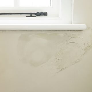 Damp penetrating wall under a windowsill